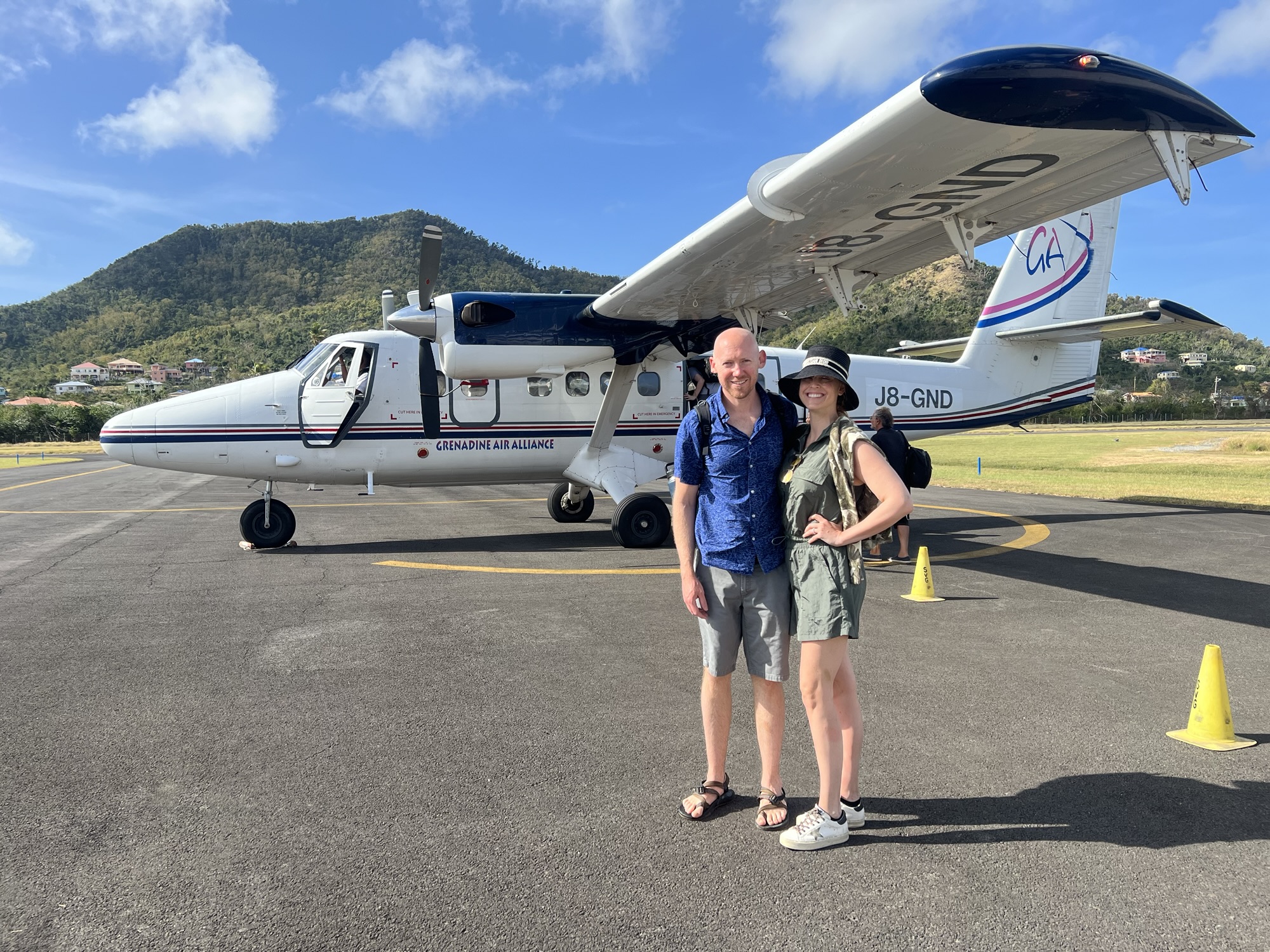 Small island hopper flight from Grenada to Carriacou over the turquoise Caribbean Sea.